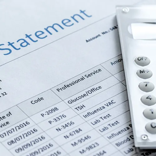 Billing statement document with itemized services and patient details, partially covered by a white calculator on the right side